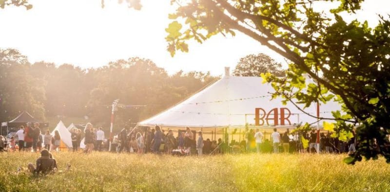 marquee in a field at also festival