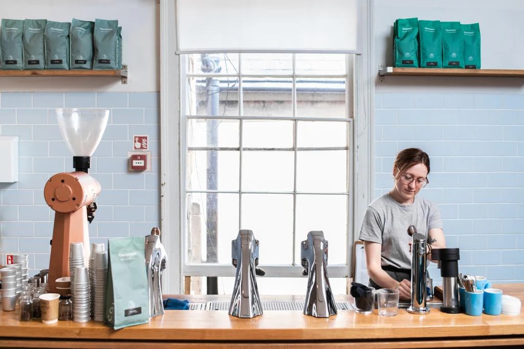 Staff at Colonna & Small's Bath working behind the counter.
