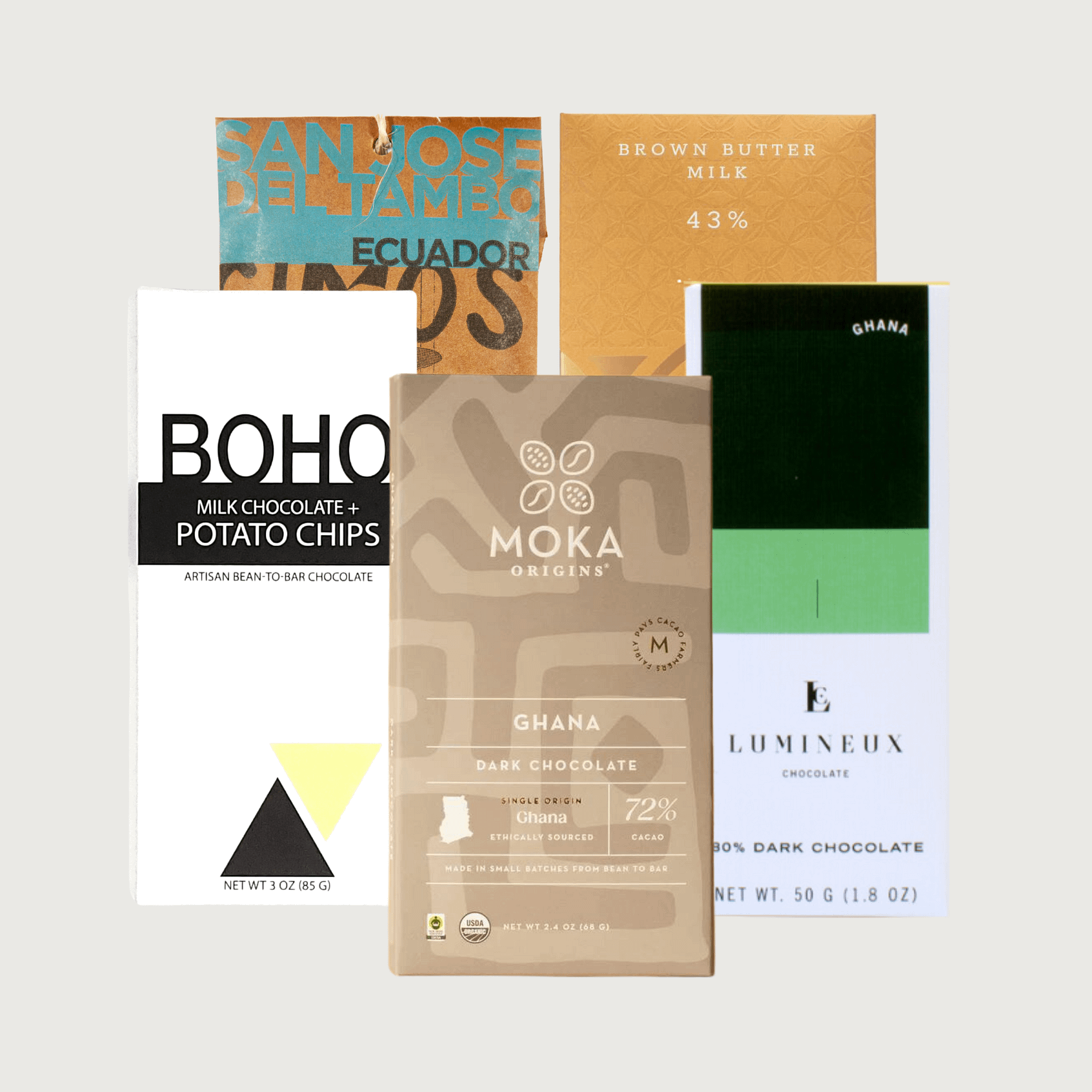 Picture of our thanksgiving box on a grey background - Moka, Boho, Lumineux, Askinosie and Fruition bars