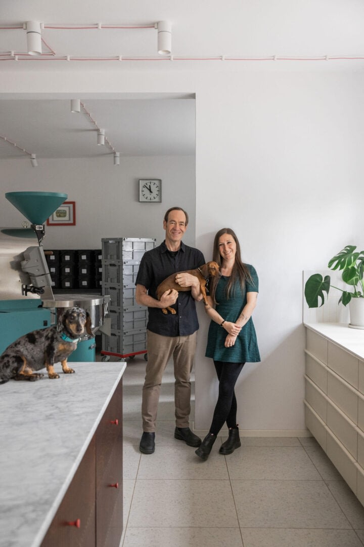 Petra and Gwilym with their two naughty dogs at The Naughty Dog Roastery.